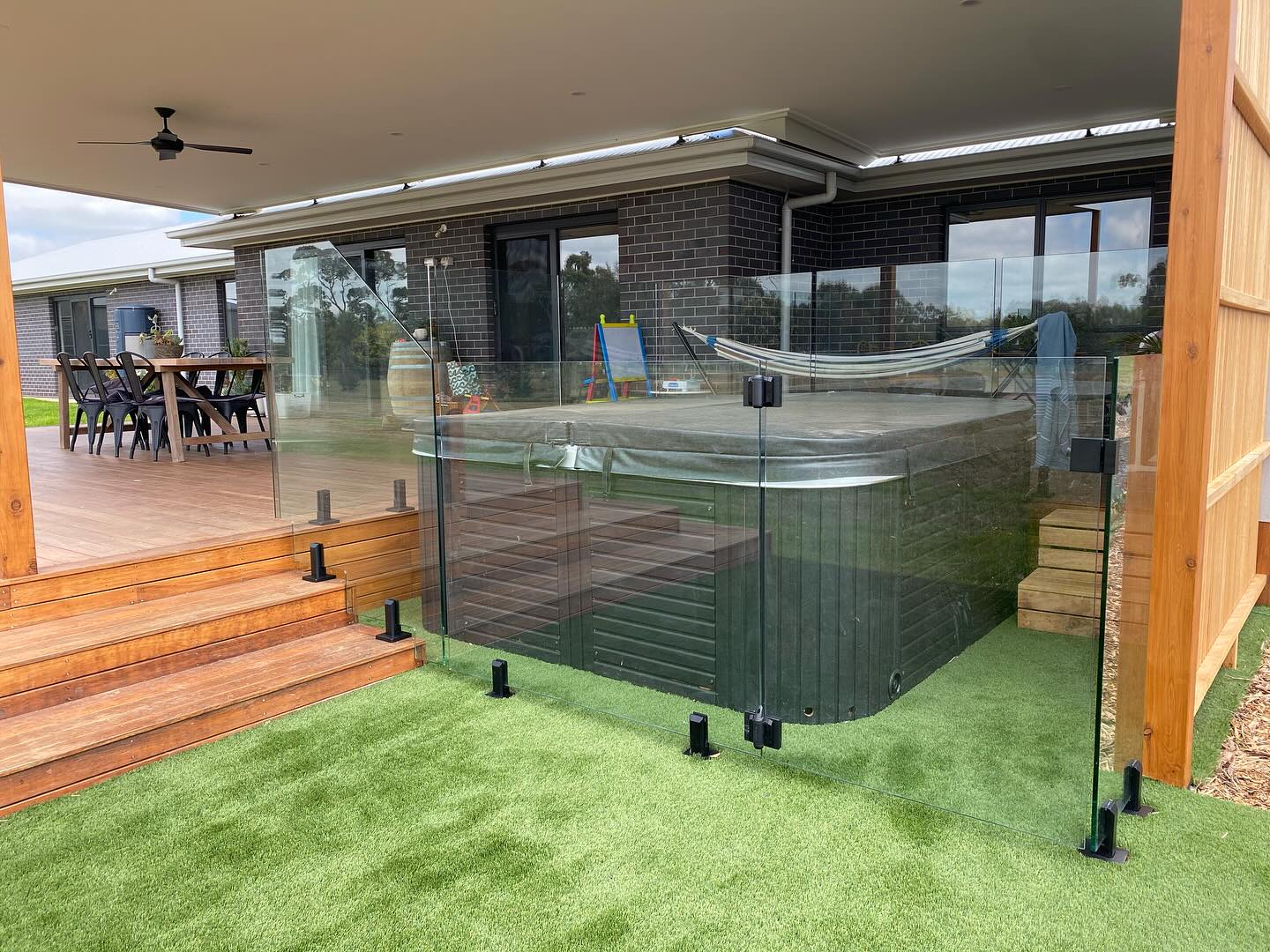 Frameless glass pool fence with garden outlook